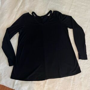Black long sleeve boutique shirt, with detail in the neck line